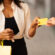 woman holding shopping bags and a gift card